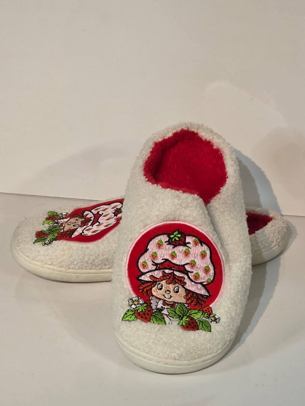 Brand new Strawberry Shortcake fuzzy slippers in Unisex Adult size EU 45–46.